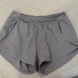 Grey active shorts with shorts underneath.  size L